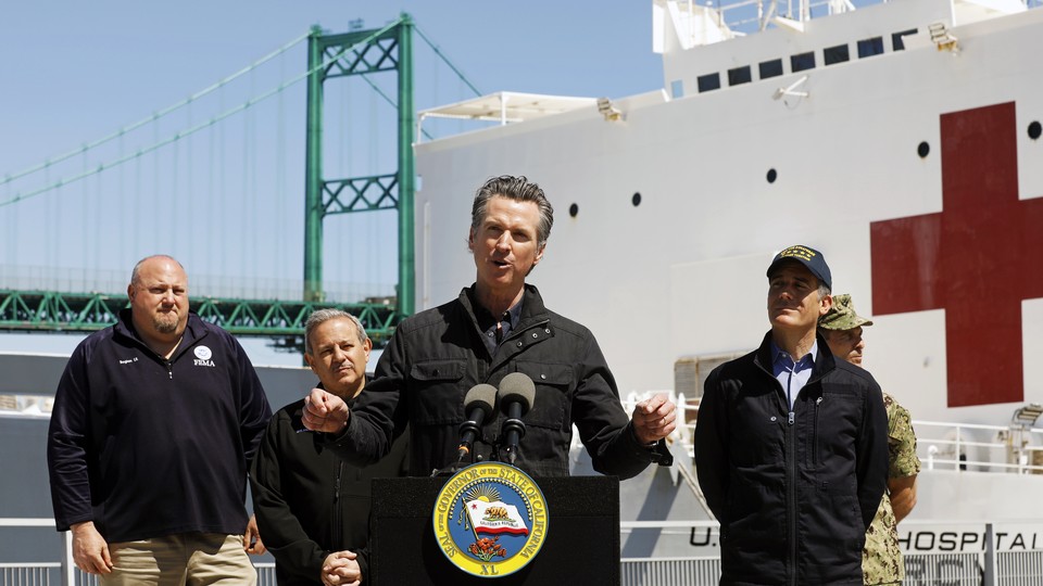California Governor Gavin Newsom speaks in front of the hospital ship USNS Mercy that arrived into the Port of Los Angeles.