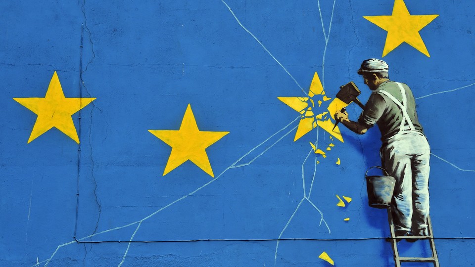 A Banksy mural depicting an EU flag being chiseled by a workman