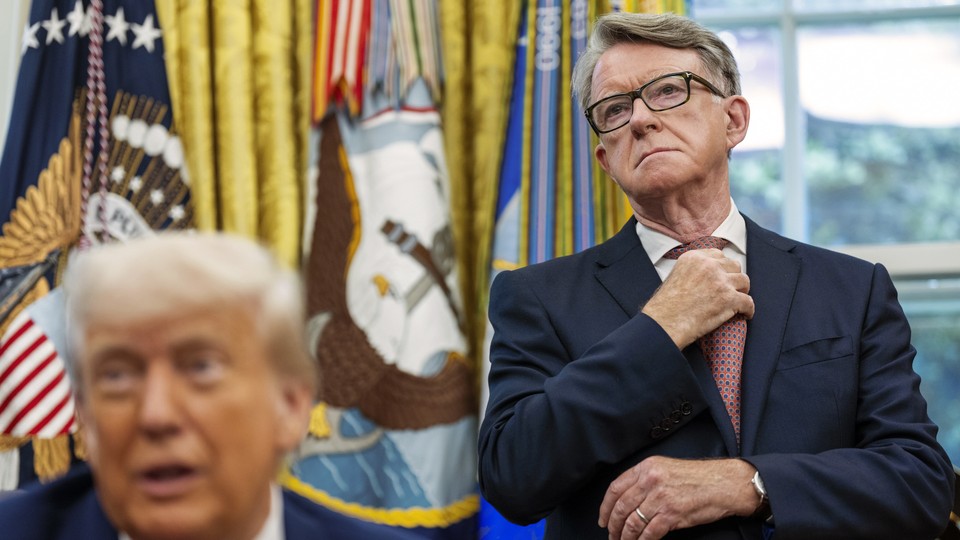 Photograph of British ex-ambassador standing behind Donald Trump