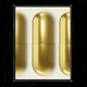An image of three gold-colored pills, slightly blurred