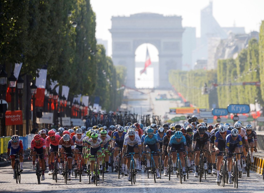 The peloton rides along the Champs-Élysées in Paris.