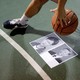A basketball is dribbled over pictures of President Xi Jinping and Hong Kong Chief Executive Carrie Lam.