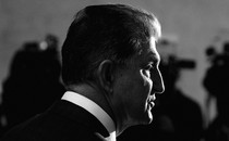 A black-and-white image of Senator Joe Manchin in profile