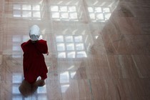 Protester dressed as a Handmaid