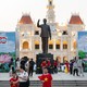 An image of people walking on a pedestrian street near the Ho Chi Minh Monument in Ho Chi Minh City, Vietnam