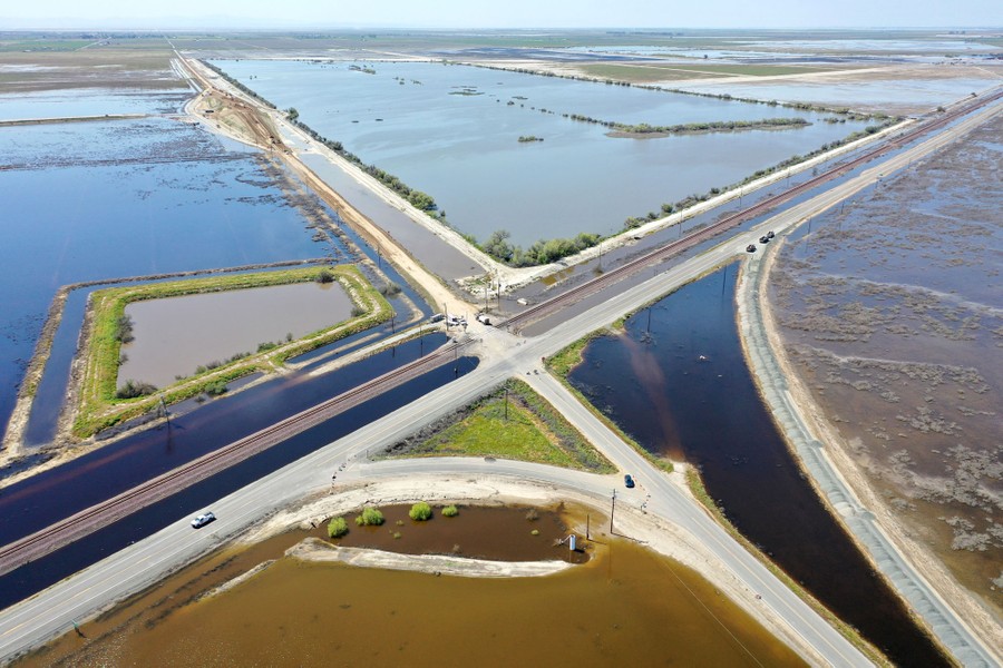 An aerial view of floodwaters inundating farmland