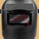 An image of a welding mask with a downward trending graph on top.