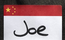 An illustration showing a “Joe” name tag attached to a suit lapel.