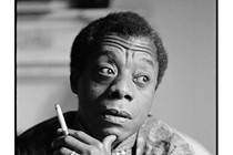 Black-and-white portrait of James Baldwin