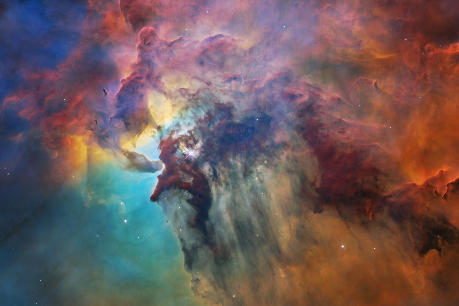 A colorful, dense cloud of dust and gas, backlit in part by hidden stars