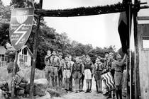 Nazi youths in uniform salute at the entrance to a German American Bund camp