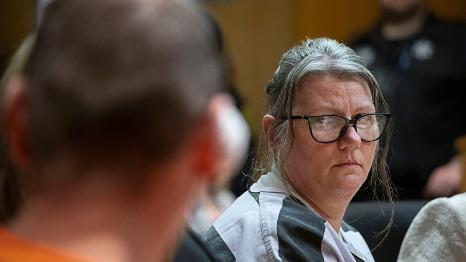 Jennifer Crumbley looks at her husband James Crumbley during their sentencing on four counts of involuntary manslaughter for the deaths of four Oxford High School students by their son, mass school shooter Ethan Crumbley, on April 9, 2024 at Oakland County Circuit Court in Pontiac, Michigan.