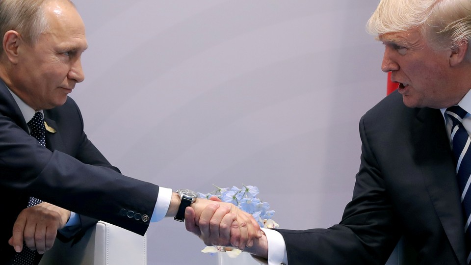 U.S. President Donald Trump shakes hands with Russian President Vladimir Putin during the their bilateral meeting at the G20 summit in Hamburg, Germany, July 7, 2017. 