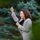 California Senator Kamala Harris speaks to a crowd with her arm raised at Polk County Democrats’ Steak Fry in Des Moines, Iowa in September.