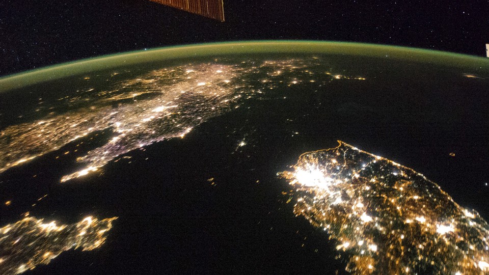 A view of Earth from space with artificial lights at night