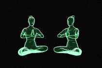 two green meditating silhouettes sat next to each other