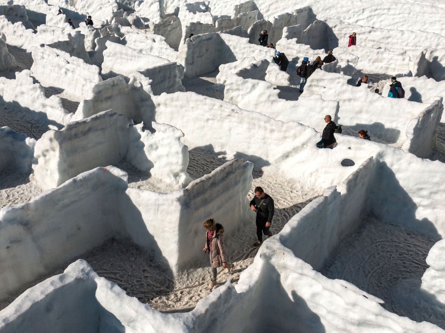 People try to find their way out of a melting snow maze