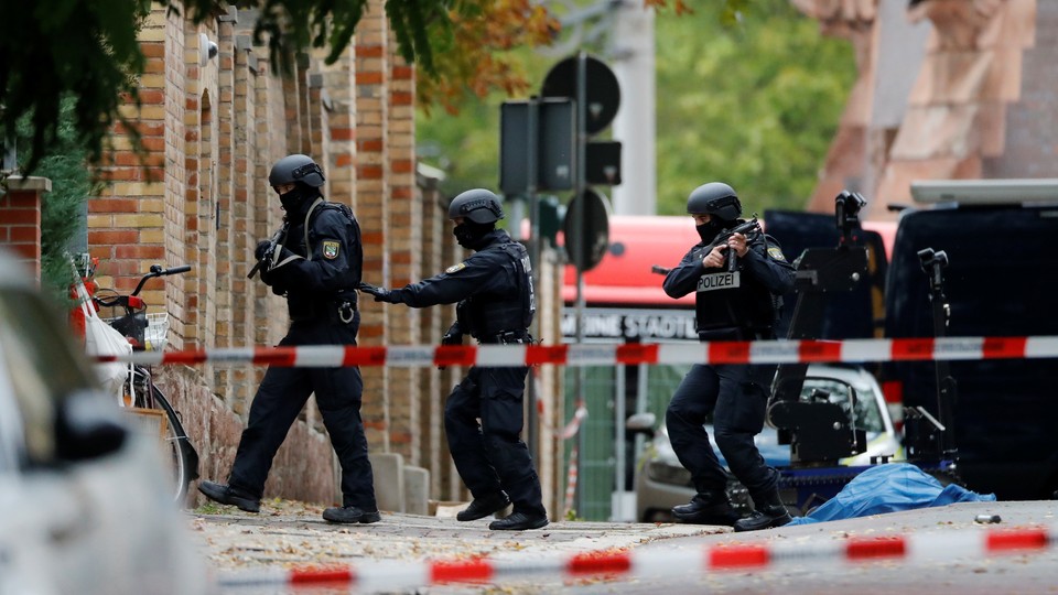 Police officers at the site of the Halle shooting