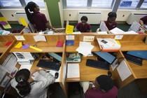 An overhead shot of students working on computers