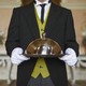 Butler holding a serving tray