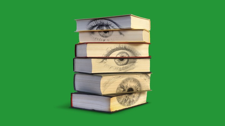 A stack of books with eyes on the pages