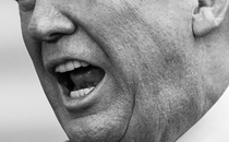 A black-and-white photo of the lower half of Trump's face while he's speaking