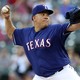 The Texas Rangers starting pitcher Bartolo Colon (40) throws during the first inning against the New York Yankees at Globe Life Park in Arlington on May 22