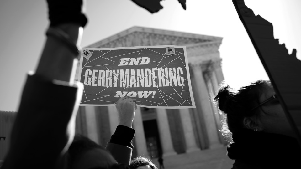 Demonstrators outside the Supreme Court protest the unconstitutionality of gerrymandering, on March 26, 2019.