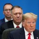 Donald Trump, Mike Pompeo, and Mick Mulvaney sit in a line while attending a NATO summit.