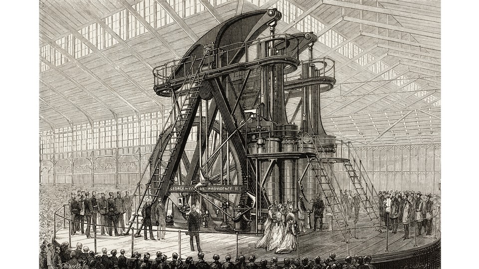 black-and-white engraving-style illustration of steam-powered machine several stories high with large wheel and stairs inside large wooden building with high windows, surrounded by men and women onstage in period dress