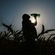 A wheat farmer in India drinks water during the April heat wave.