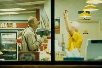 Nicholas Cage wears pantyhose over his head and sticks up a convenience store