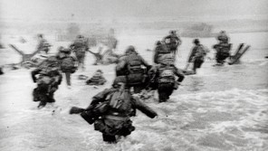 FRANCE. Normandy. June 6th, 1944. US troops assault Omaha Beach during the D-Day landings.