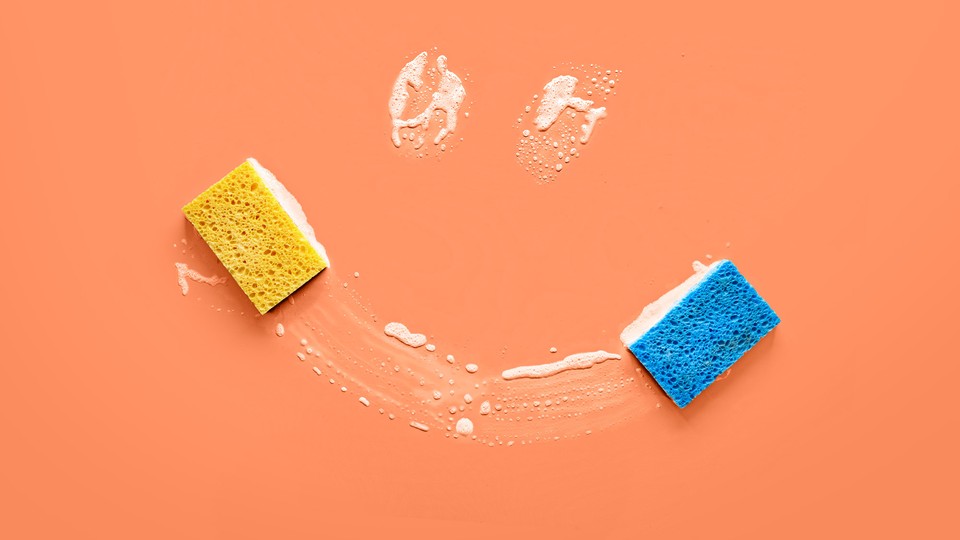 A picture of soap suds and sponges, forming the shape of a smiley face
