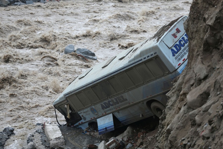 A bus is seen after a landslide and flood in Chosica, east of Lima, Peru, on March 16, 2017.