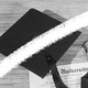 A photo-illustration featuring a graduation cap, gown, and diploma. A white line crosses through the middle