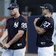 New York Yankees' Aaron Judge, left, and Giancarlo Stanton stretch at baseball spring training camp