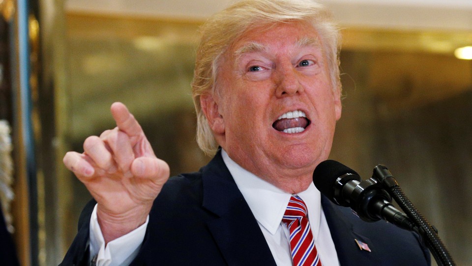 President Trump points to reporters.