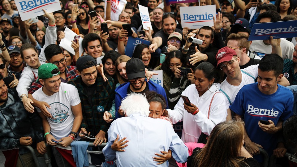 Bernie Sanders with a crowd of supporters