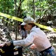 A member of the Argentine Forensic Anthropology Team works at the scene of the El Mozote massacre.