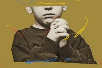 An image of a young boy praying