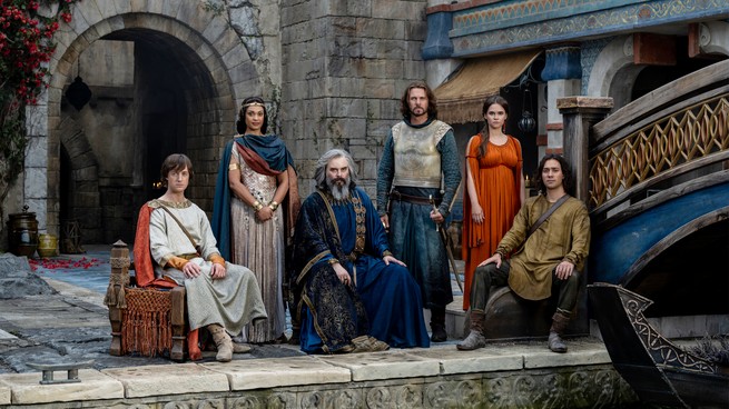 A group of characters sitting regally and staring at the camera in "The Lord of the Rings: The Rings of Power"