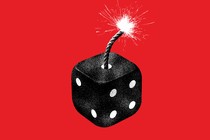 a black die with a lit fuse