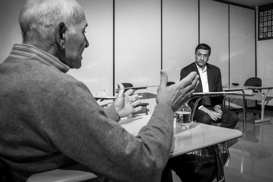 Picture of Ro Khanna listening to his former social studies teacher Derek Longo