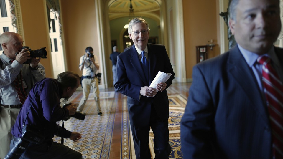 Senator Mitch McConnell walks to his office at the U.S. Capitol in Washington.