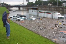 Stranded motorists look over a flooded I-45 North near downtown Houston after tropical storm Allison, in 2001.