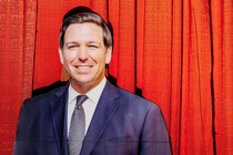 An image of a cut-out poster of Ron DeSantis.