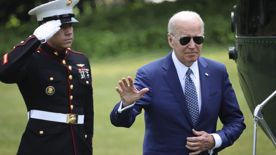 U.S. President Joe Biden waves as he returns to the White House
