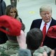 Donald Trump holds a cap while visiting U.S. troops at Ramstein Air Base in Germany on December 27, 2018.