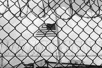 An American flag flies over Camp 6 detention center in Guantánamo Bay, Cuba